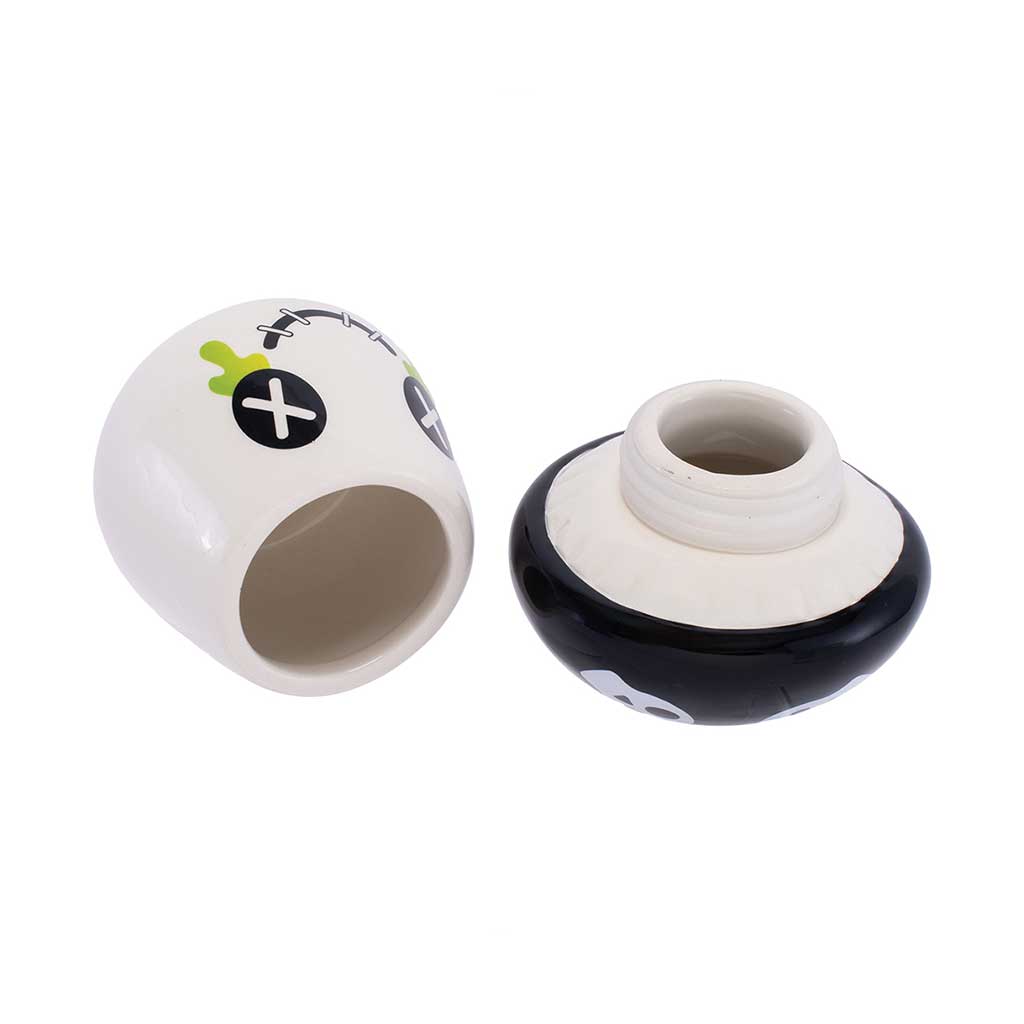 Base and cap separated, showing the ceramic jar cavity and threaded lid insert.