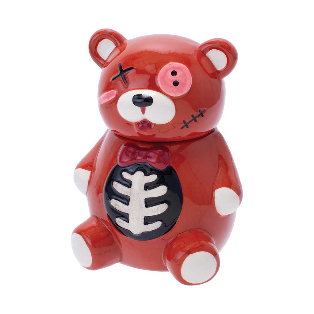 Angled view of the red ceramic Zombie Scare Bear jar with ribcage motif inside the bowl.
