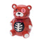 Angled view of the red ceramic Zombie Scare Bear jar with ribcage motif inside the bowl.