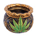 Front angle of the black-and-gold Royal Leaf Cauldron Ashtray with green leaf motif.