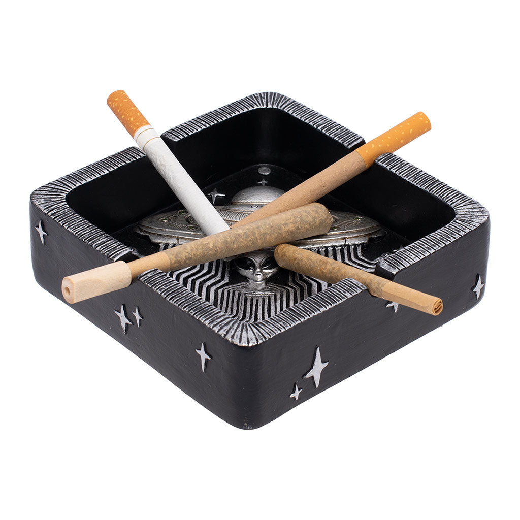 Silver UFO Ashtray in black resin shown in use with four rests holding cones and a cigarette