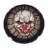 Scary Clown Ashtray in black resin shown from above with a 3D face and two rim notches