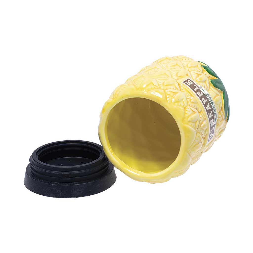 The Large Pineapple Ceramic Storage Jar by Fujima shown on its side with the black lid removed