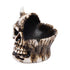 Half Skull Ashtray in bone resin, angled view with deep charcoal bowl and jagged rim