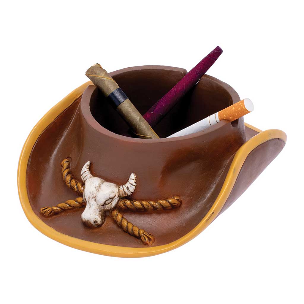Cowboy hat ashtray in use, holding mixed smokes; brown resin with steer skull detail