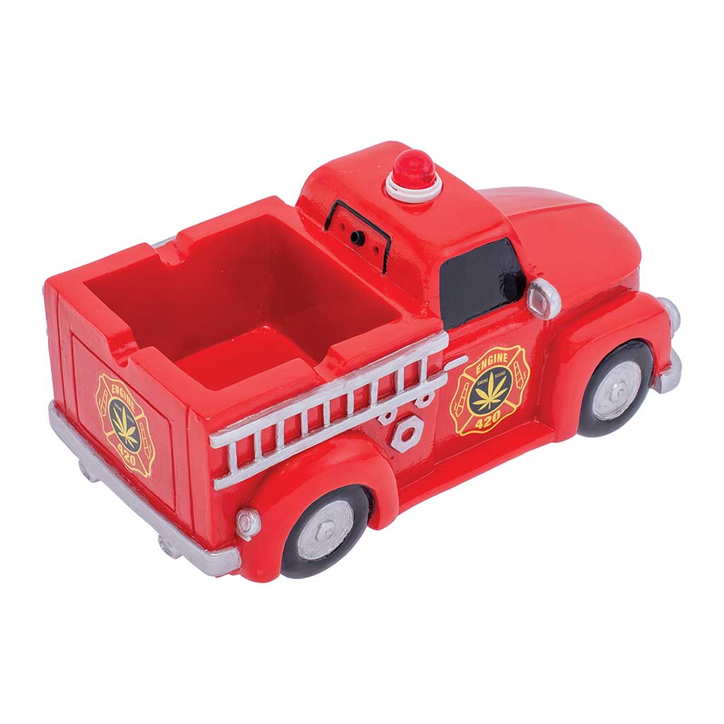Three-quarter view of the Red 420 Light-Up Firetruck Ashtray & Stash with rails and wheels. 