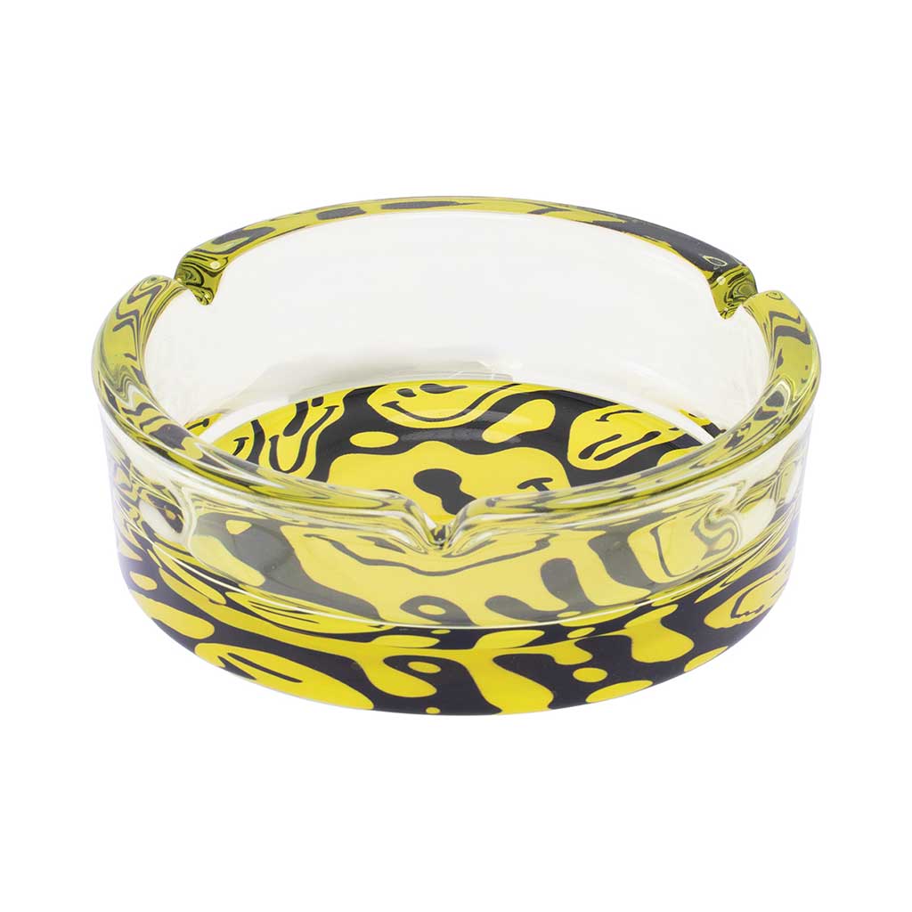 Add style to your smoke setup with the Yellow Melting Smiley Glass Ashtray. Sturdy glass, unique design, and quick delivery. Shop Honeybee Herb now!