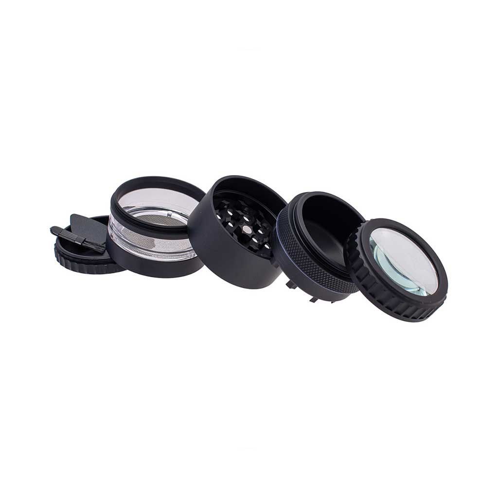 Black Herb Grinder With Magnifying Top And Multiple Parts Shown In Angled View 