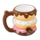 Donut Premium Roast and Toast pipe mug with glossy chocolate, vanilla, and pink icing layers, colorful sprinkles, curved handle, and front bowl