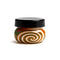 Forest Blaze Rounded Wig Wag Swirl Baller Storage Jar shown with a black lid at Honeybee Herb