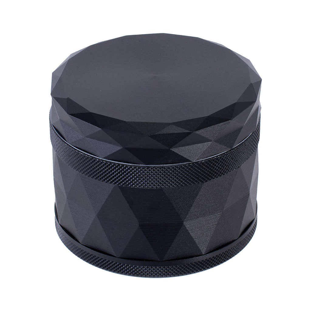 Top view of Harlequin Pattern Grinder in black finish with textured grip and diamond-cut design 