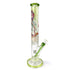 Angled view of IB Linda Biggs straight tube bong with green downstem and bowl and full color artwork on the tube 