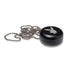 Rear view of the black Playboy by Ryot Pendant Puck showing the attachment loop for hanging.
