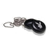 Another close-up of the Playboy by Ryot Pendant Puck, focusing on the textured surface.