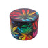 aluminum 4-piece herb grinder with jungle fever leaf artwork on the lid, top view 