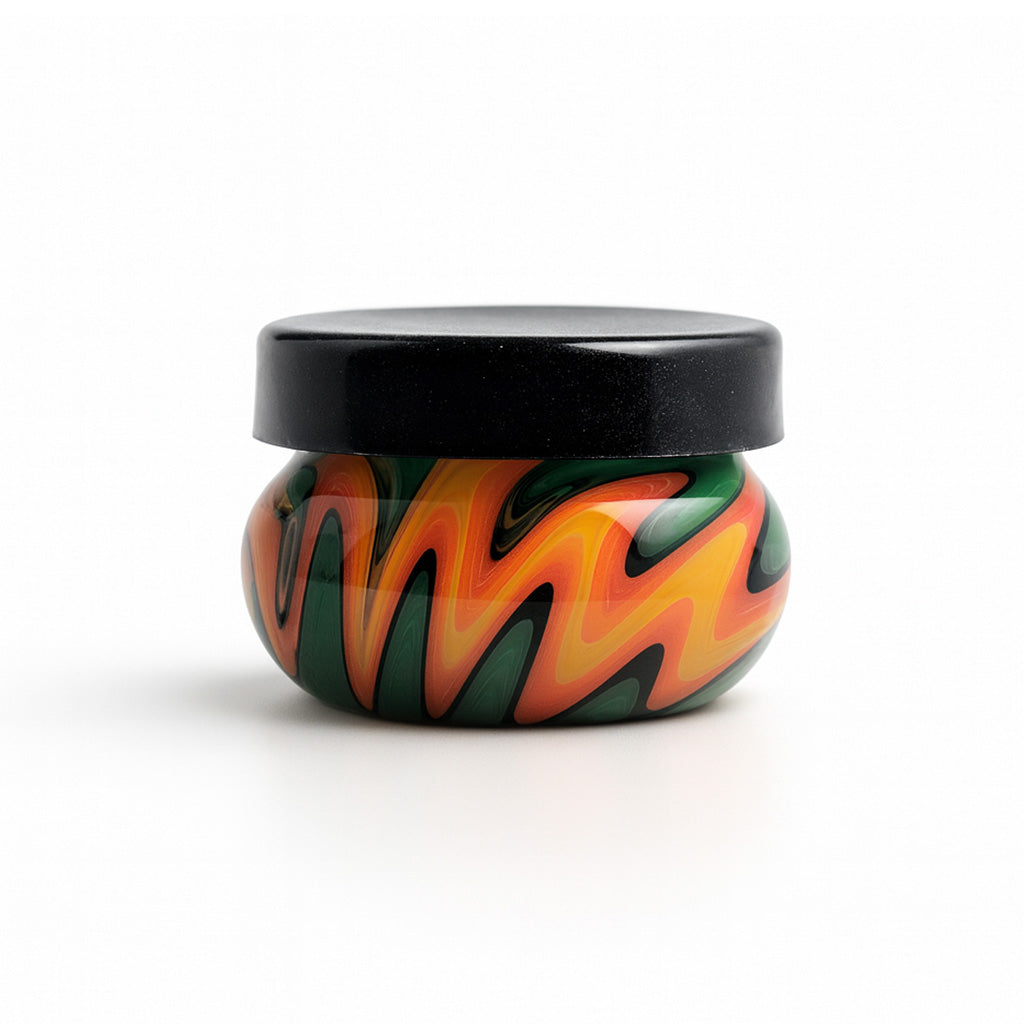 Wildfire Jungle Rounded Wig Wag Swirl Baller Storage Jar shown with a black lid at Honeybee Herb