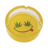 Yellow Smiley Leaf Glass Ashtray top view, durable glass with bold smiley leaf artwork, available online at Honeybee Herb