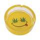 Yellow Smiley Leaf Glass Ashtray top view, durable glass with bold smiley leaf artwork, available online at Honeybee Herb